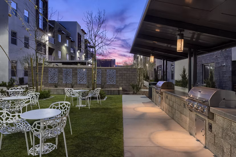 Outdoor grill area with sleek modern design at Constellation Apartments offering luxury amenities in prime city location