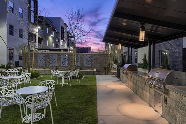 Outdoor grill area with sleek modern design at Constellation Apartments offering luxury amenities in prime city location