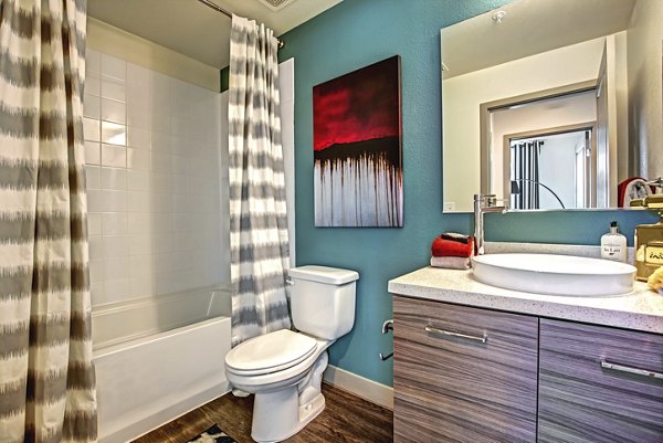 Modern bathroom with marble countertops at Constellation Apartments, part of Greystar luxury apartment collection