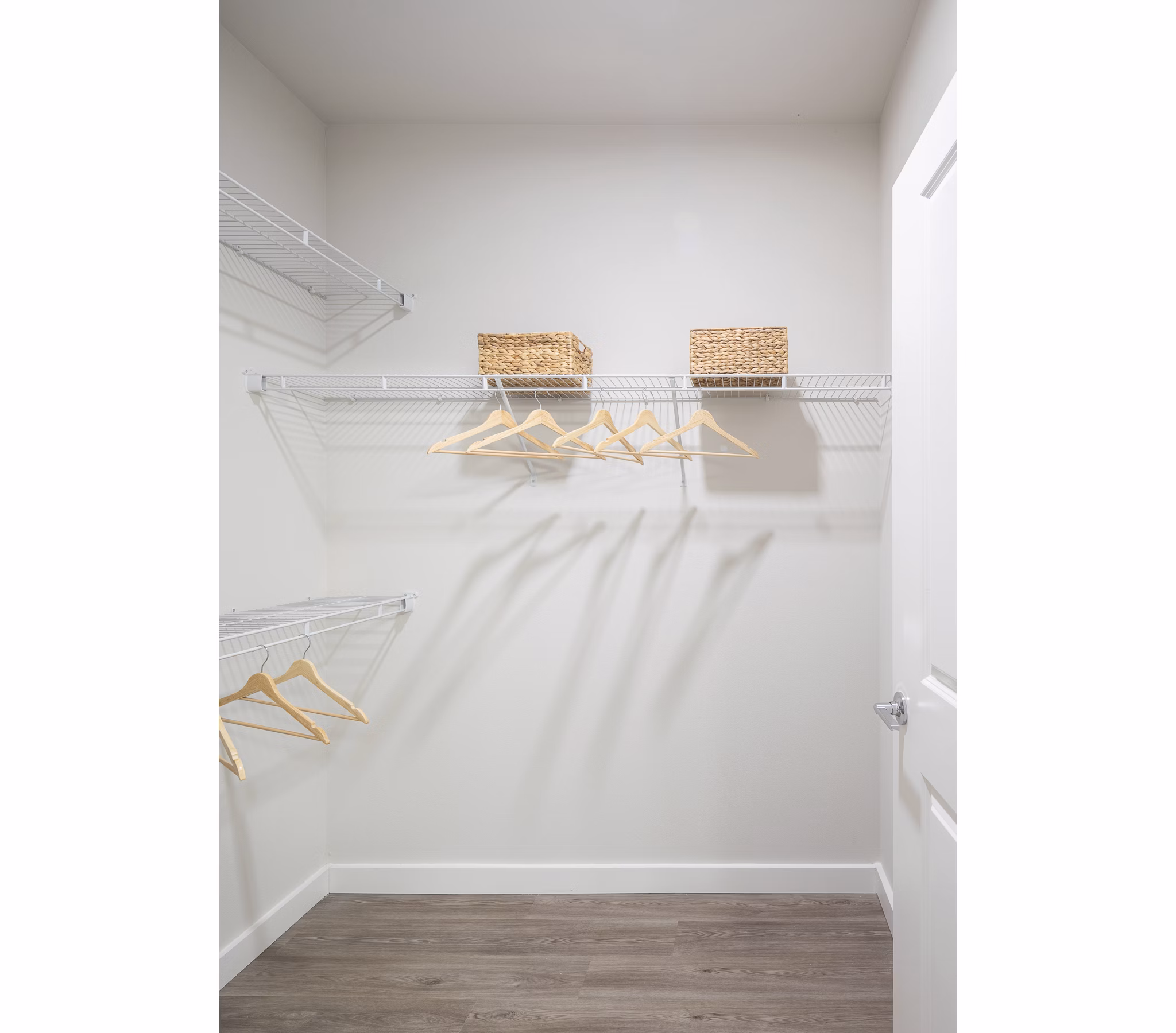 Walk-in closet with sleek shelving at Prose District West Apartments