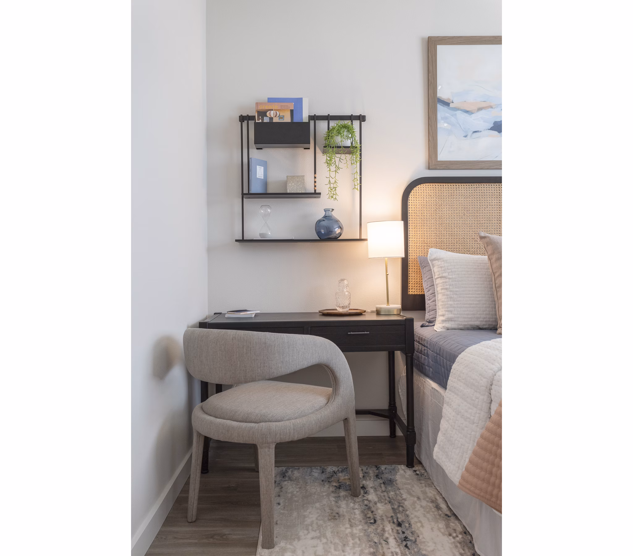 Cozy bedroom with modern furnishings at Prose District West Apartments, showcasing elegant design and comfort for residents