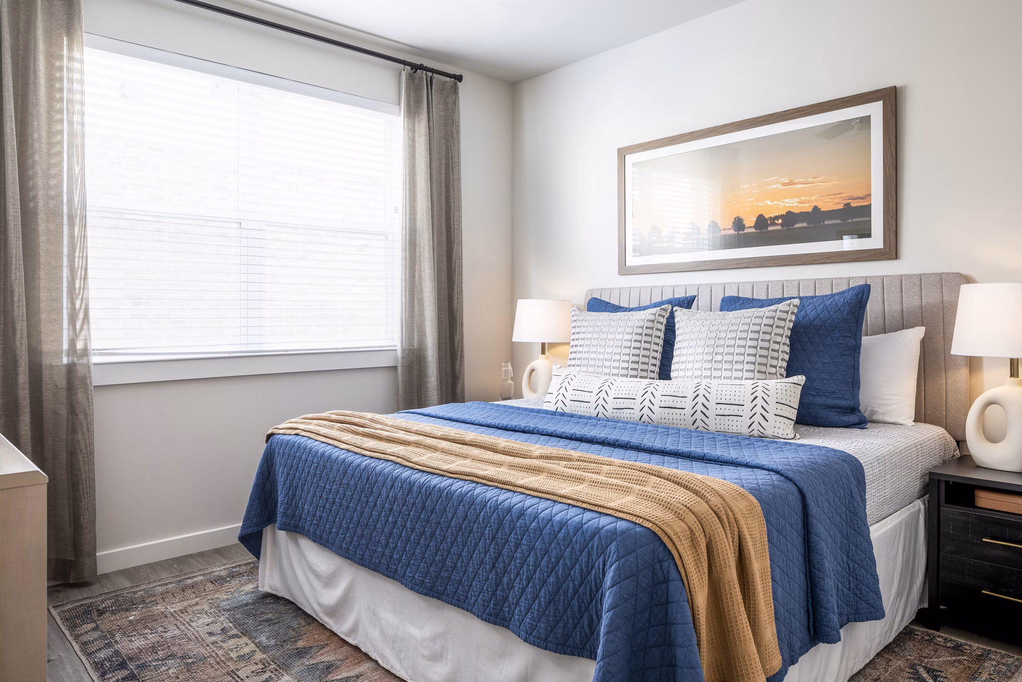 Modern bedroom with stylish decor at Prose District West Apartments