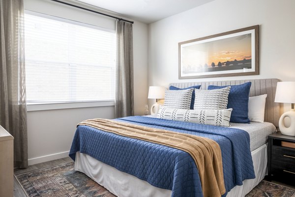 Modern bedroom with stylish decor at Prose District West Apartments