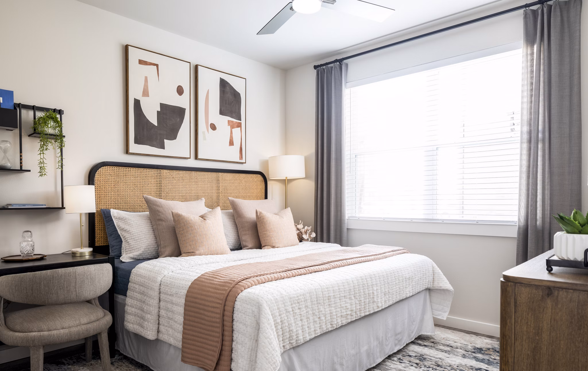 Cozy bedroom featuring modern dÃ©cor and ample natural light in Prose District West Apartments