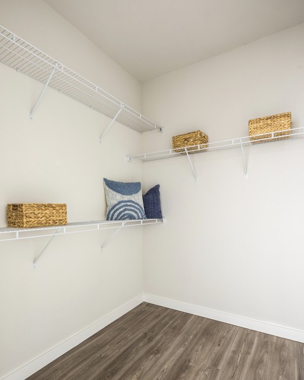 Walk-in bedroom closet with ample shelving and storage at Prose District West Apartments