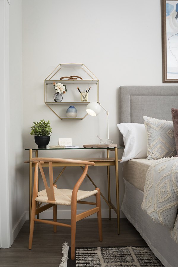 Bedroom featuring modern decor and large windows in Prose District West Apartments