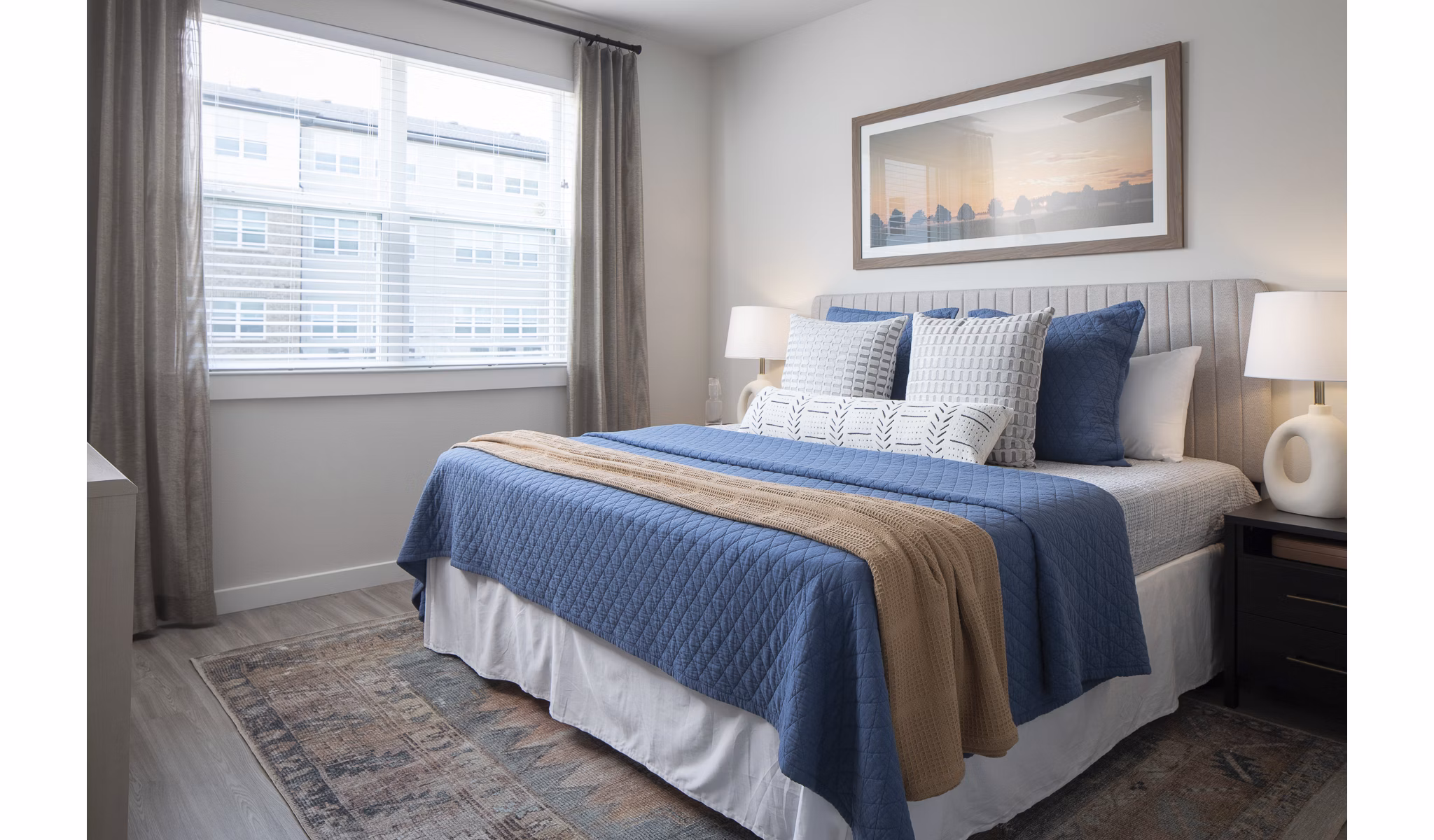Cozy bedroom with modern furnishings in Prose District West Apartments