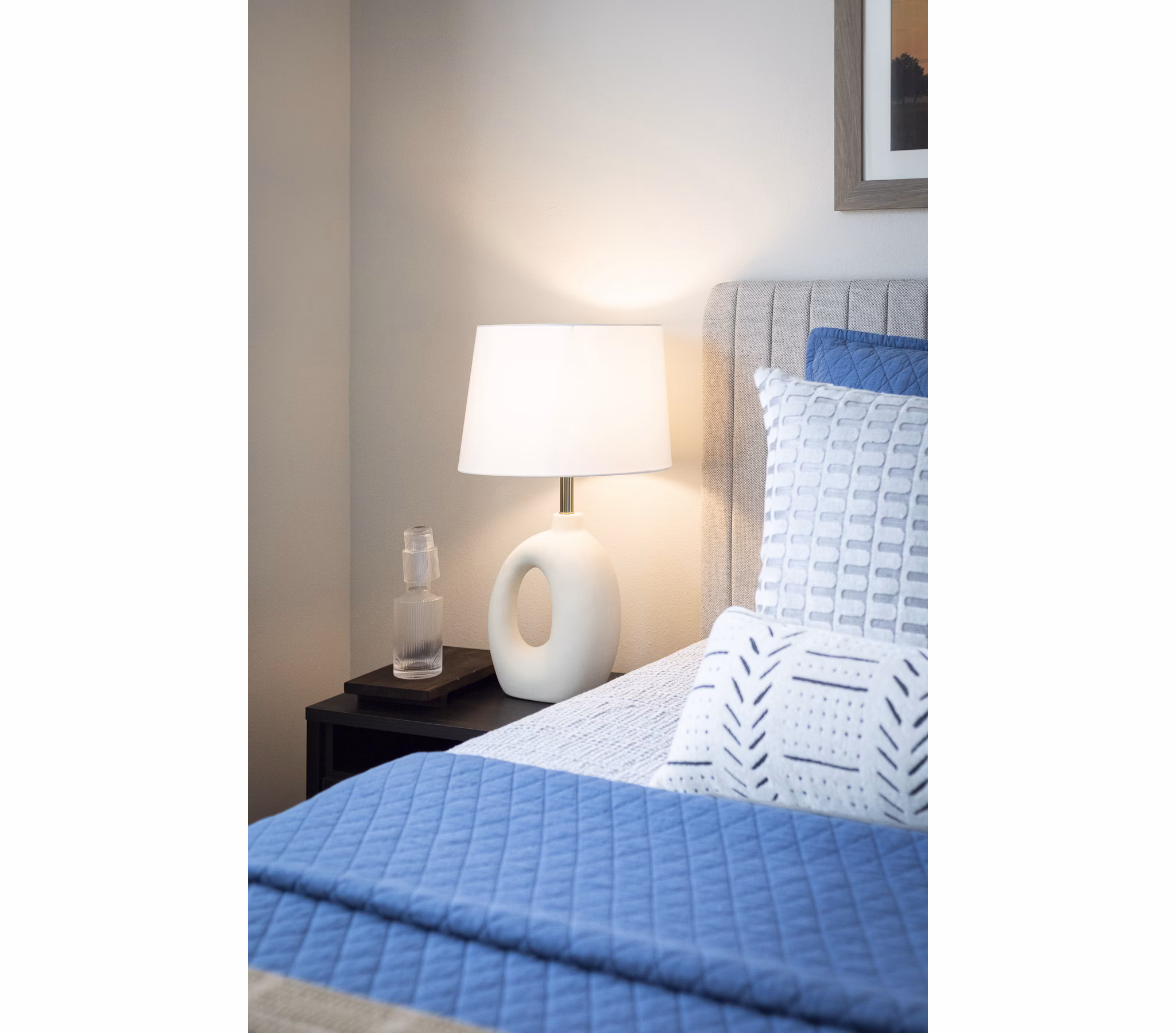 Cozy bedroom with modern decor at Prose District West Apartments
