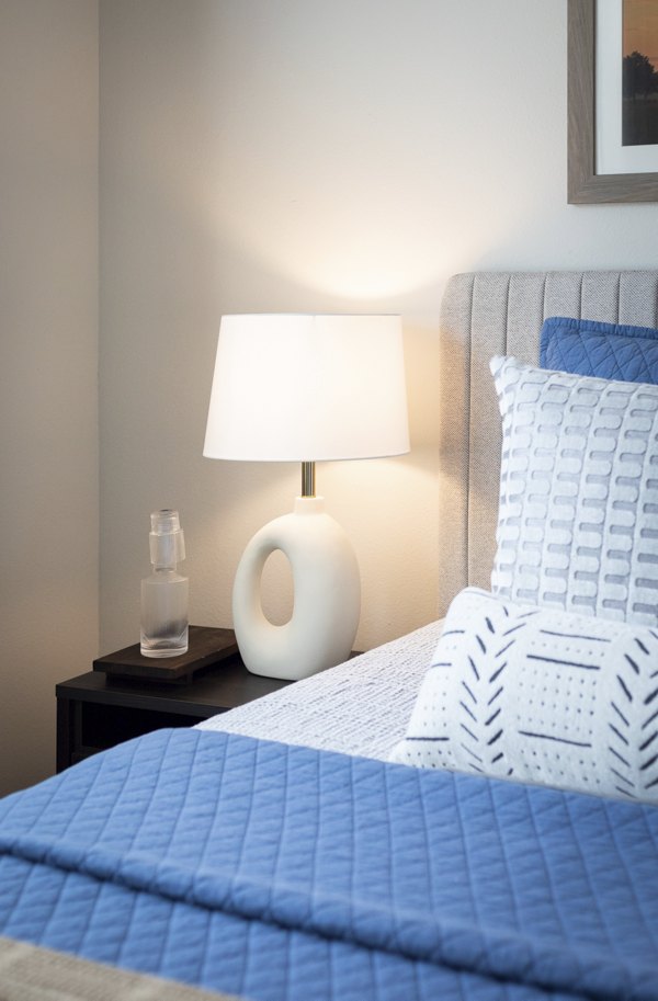 Cozy bedroom with modern decor at Prose District West Apartments