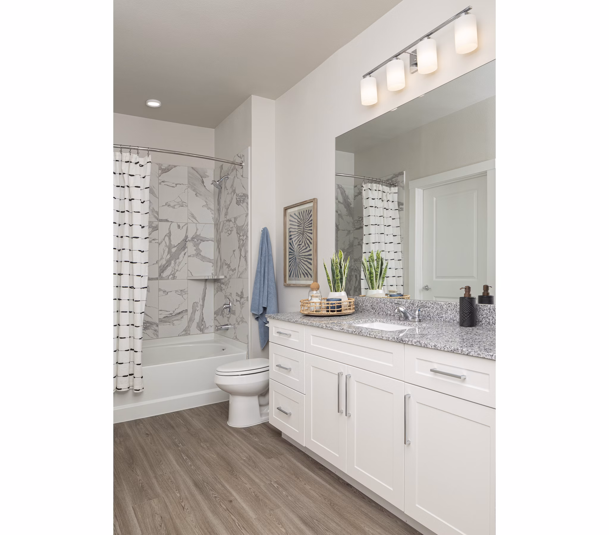 Modern bathroom with sleek fixtures at Prose District West Apartments