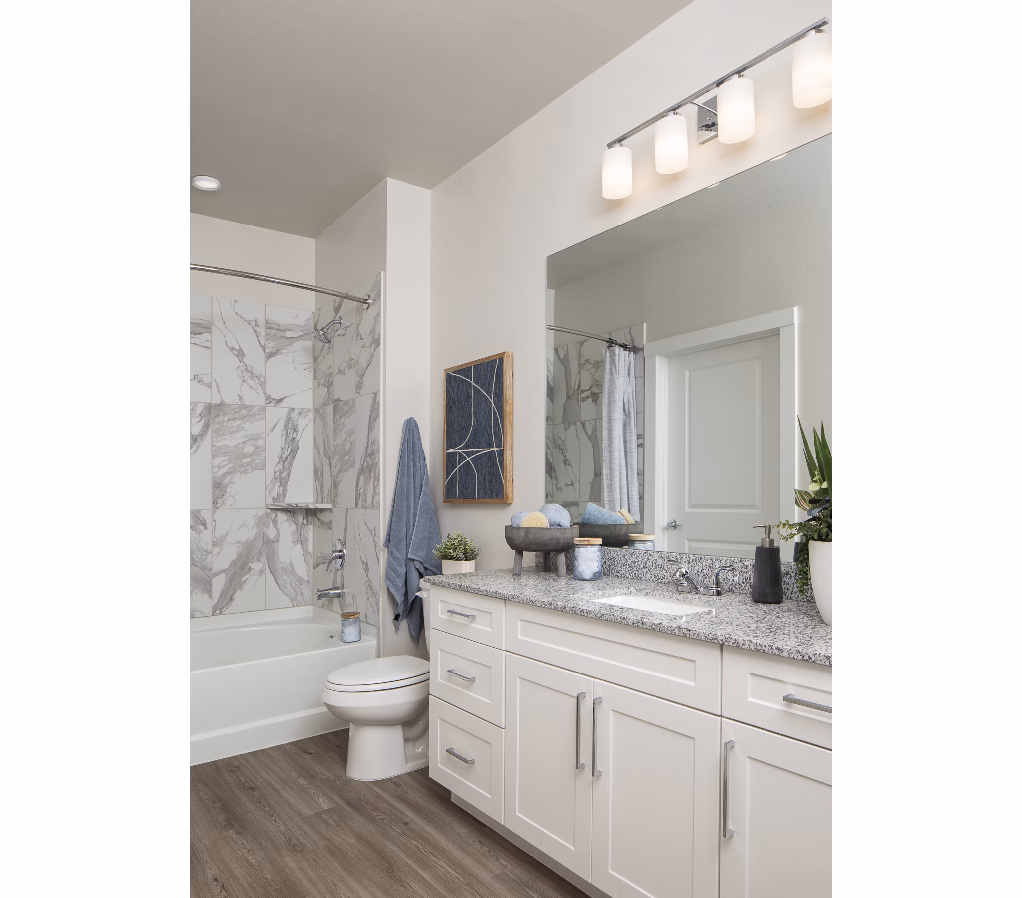 Modern bathroom with sleek fixtures at Prose District West Apartments, featuring spacious layout and elegant design
