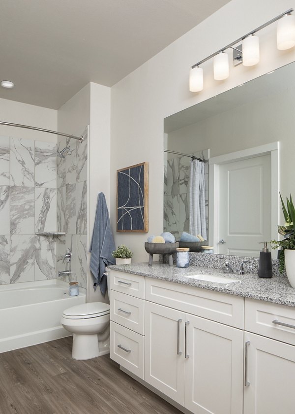 Modern bathroom with sleek fixtures at Prose District West Apartments, featuring spacious layout and elegant design