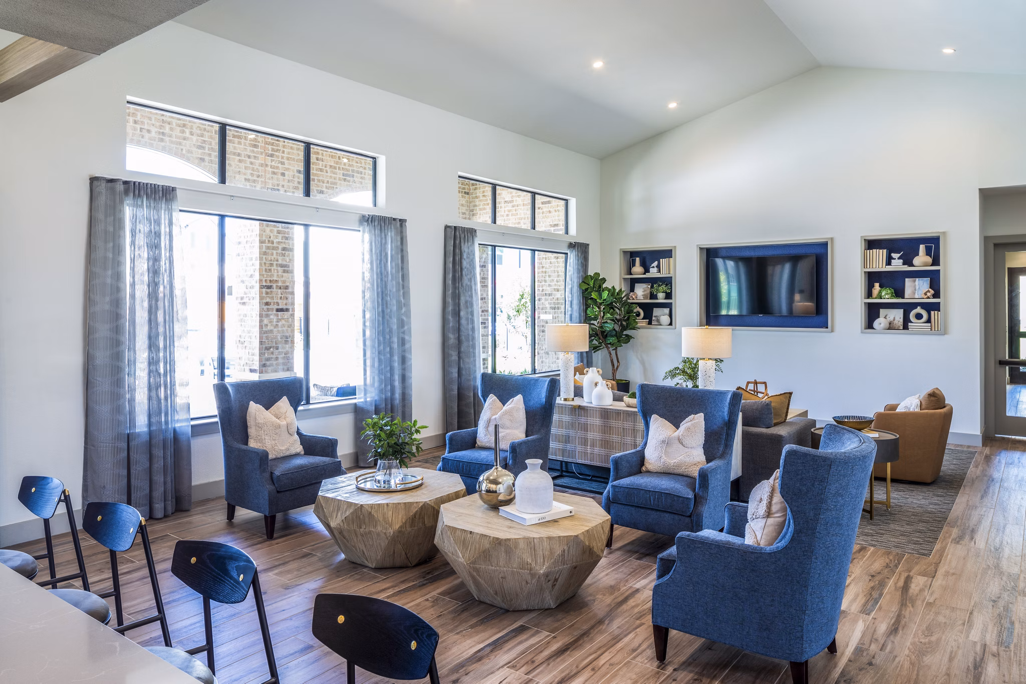 Stylish clubhouse with modern decor at Prose District West Apartments, perfect for social gatherings and relaxation