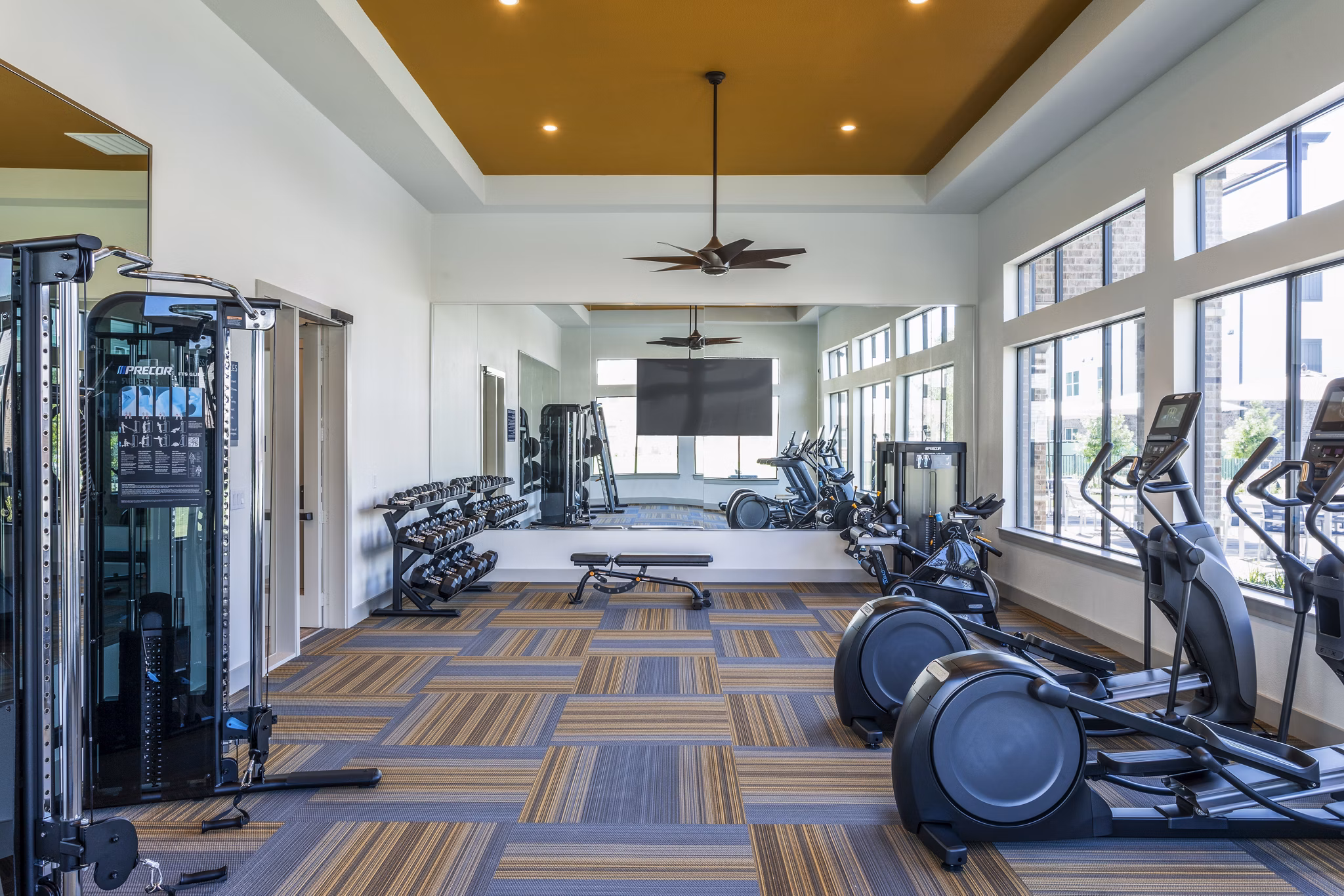 State-of-the-art fitness center with modern equipment at Prose District West Apartments