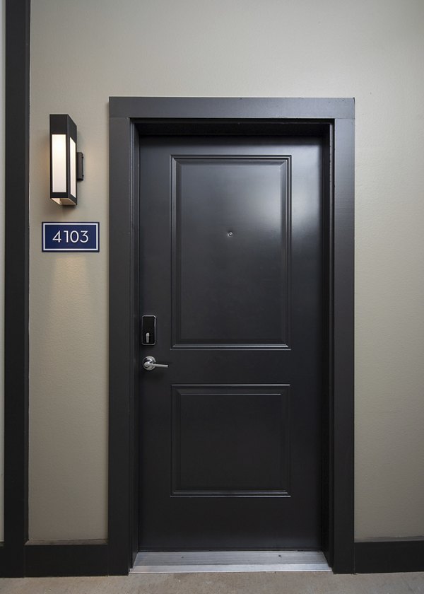Hallway featuring modern lighting and sleek flooring in Prose District West Apartments