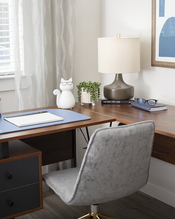 Home office featuring modern desk and ergonomic chair at Prose District West Apartments