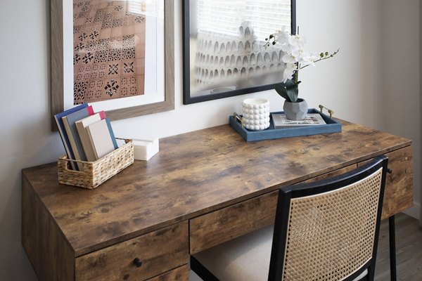 Home office with ergonomic chair and desk at Prose District West Apartments
