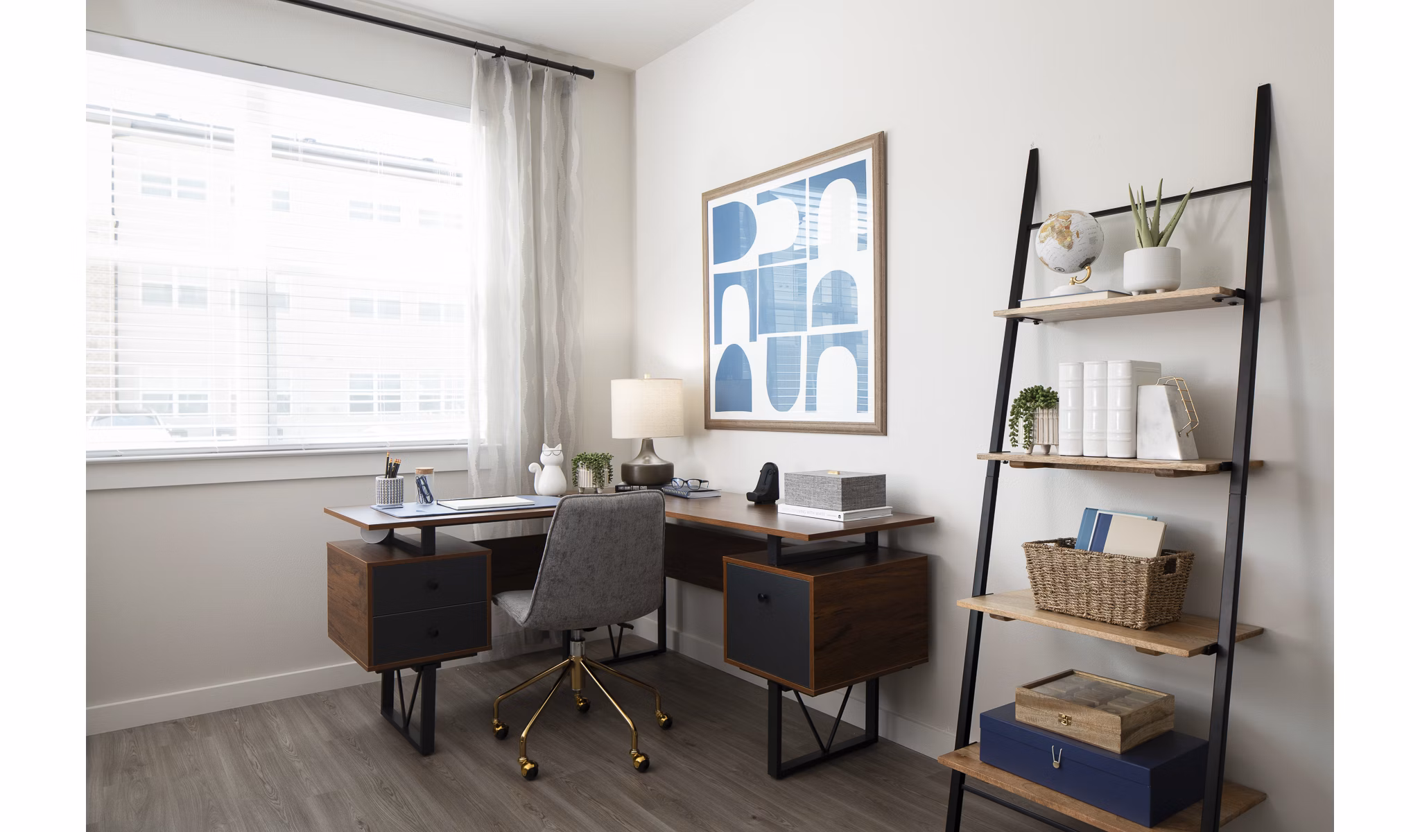 Home office with ergonomic desk and natural light in Prose District West Apartments