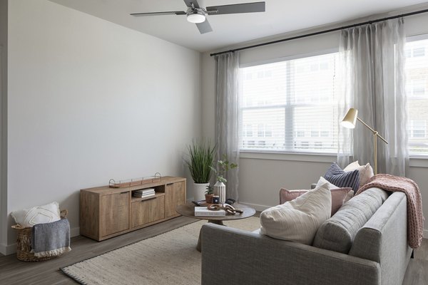 Modern living room with stylish decor in Prose District West Apartments, offering comfort and elegance for luxury living