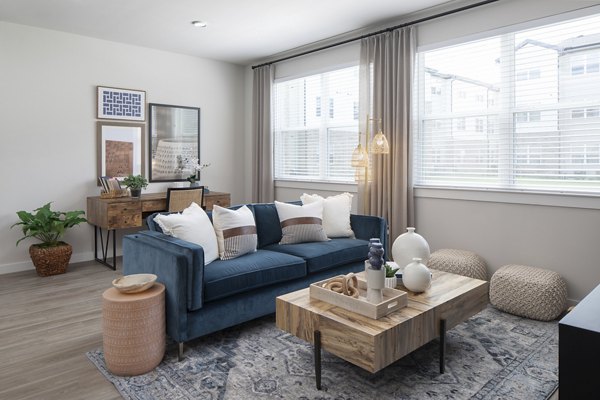 Spacious living room with modern furnishings at Prose District West Apartments, offering luxury living in a vibrant community