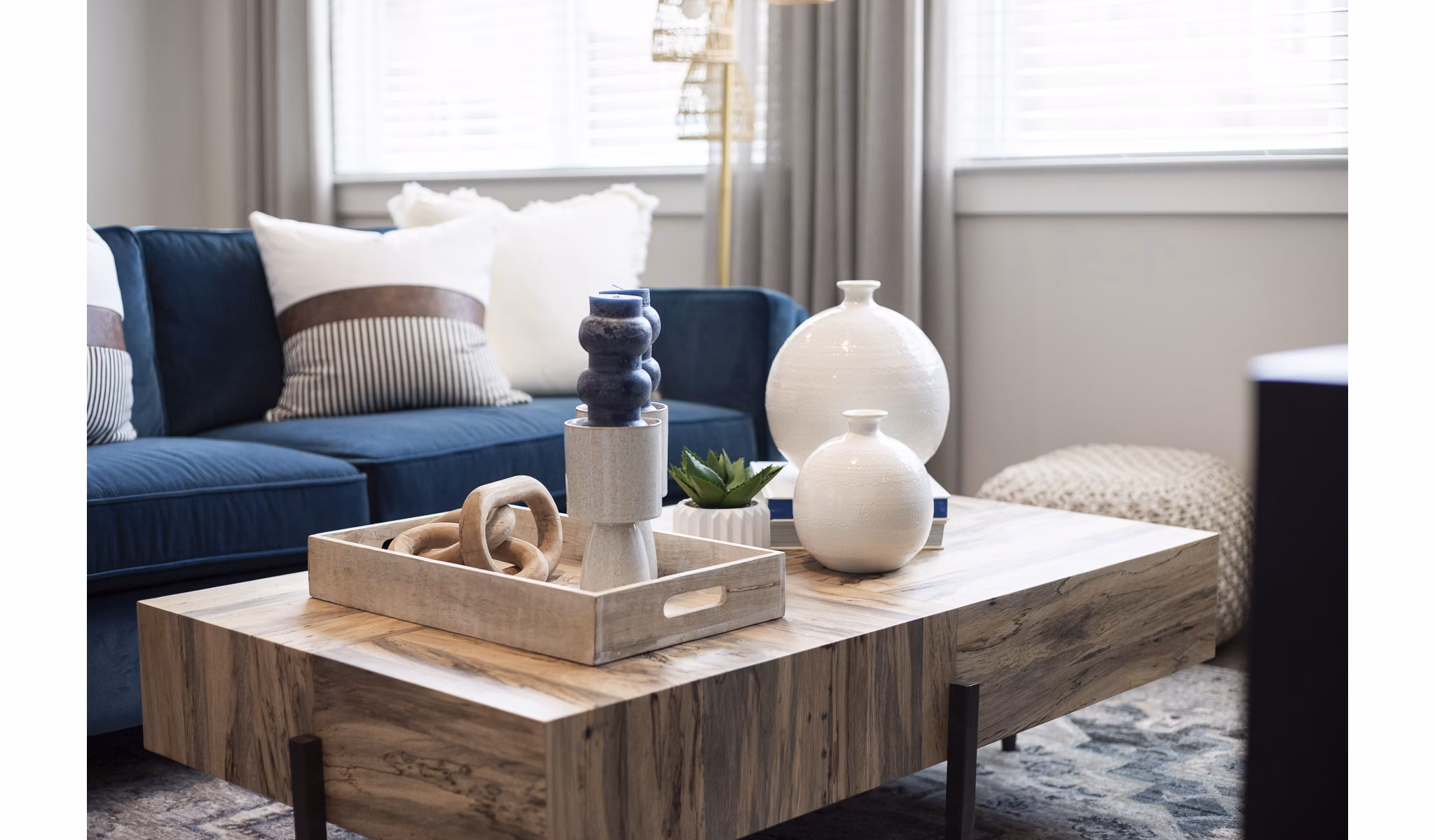 Modern living room with cozy seating at Prose District West Apartments, showcasing elegant decor and spacious layout