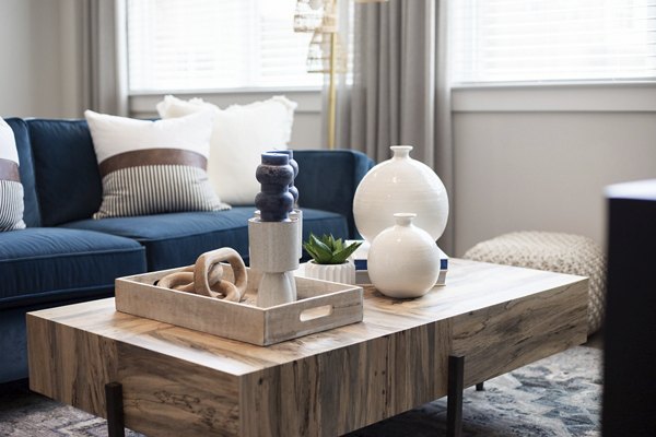 Modern living room with cozy seating at Prose District West Apartments, showcasing elegant decor and spacious layout