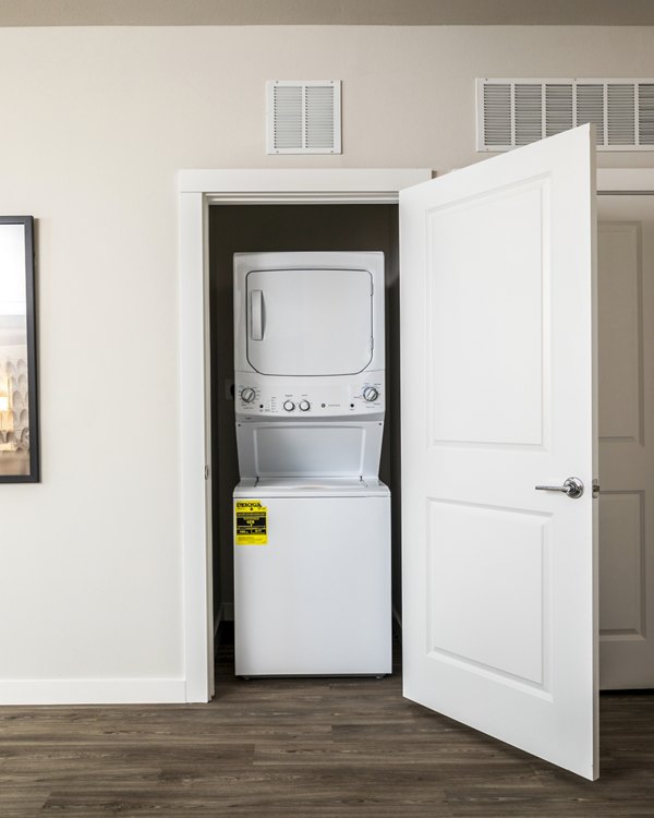 Laundry room featuring modern appliances at Prose District West Apartments, luxury living offered by Greystar