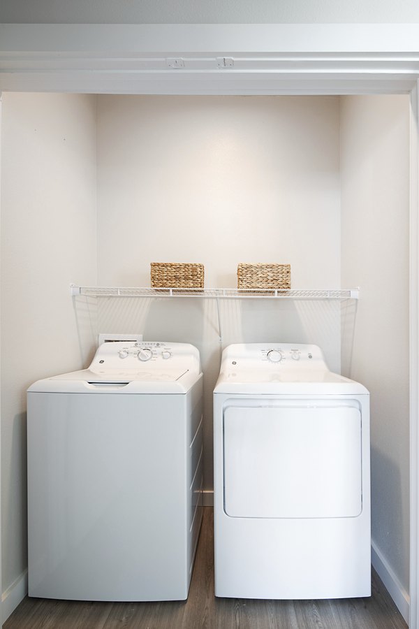 Laundry room featuring modern appliances in Prose District West Apartments