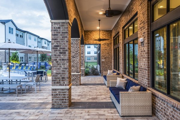 Rooftop pool and patio at Prose District West Apartments with scenic city views, offering luxury outdoor space for relaxation and entertainment