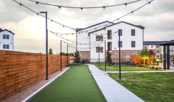 Outdoor recreational area at Prose District West Apartments featuring spacious seating and garden spaces, ideal for relaxation and community gatherings