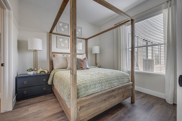 Bedroom featuring modern decor and ample natural light at Bowers Apartments