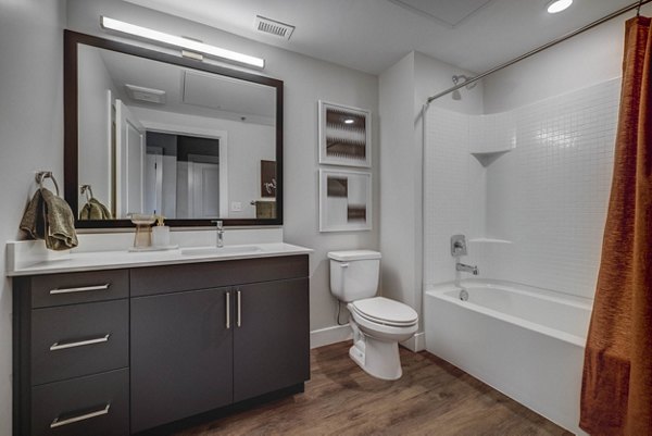 Modern bathroom with sleek fixtures at Bowers Apartments, offering luxury living