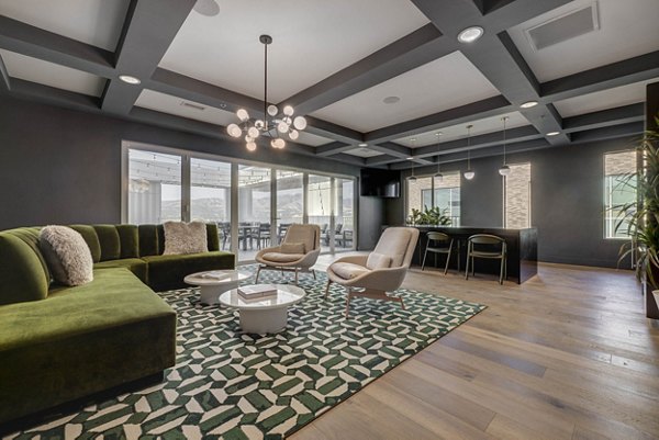 Clubhouse featuring modern furnishings and communal spaces at Bowers Apartments in a luxury setting