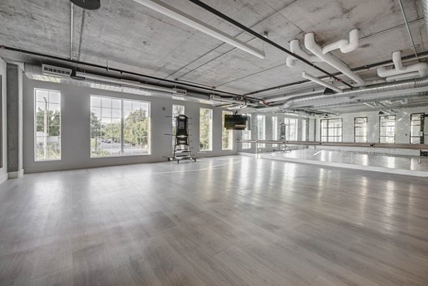 Modern yoga/spin studio with equipment at Bowers Apartments, providing wellness and fitness options for residents