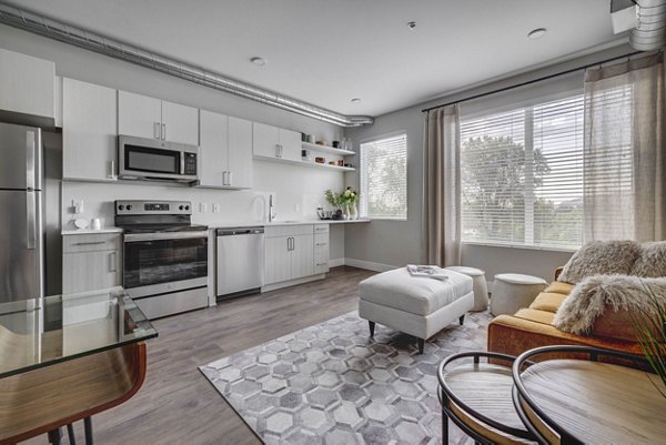 Modern kitchen with stainless steel appliances in Bowers Apartments' luxury living space