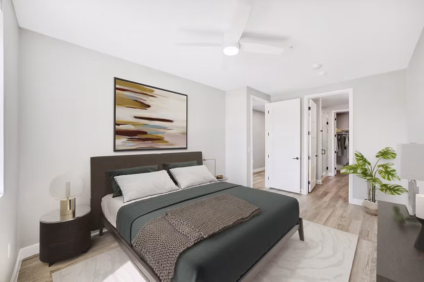 Luxurious bedroom with modern decor at Tanager Echo Apartments featuring cozy ambiance and stylish furnishings