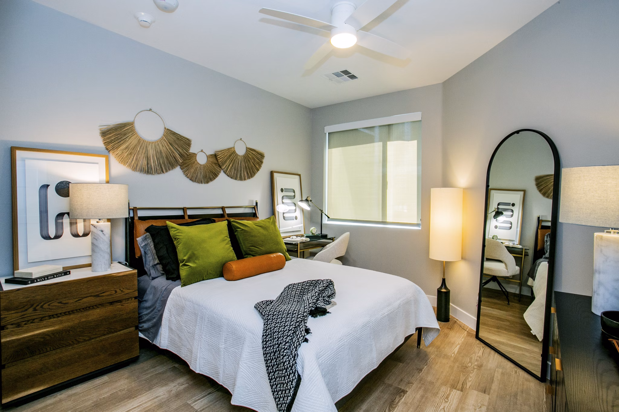 Spacious bedroom with modern decor and large windows at Tanager Echo Apartments
