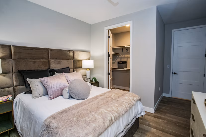 Cozy bedroom with modern decor in Tanager Echo Apartments, luxury living spaces with premium amenities