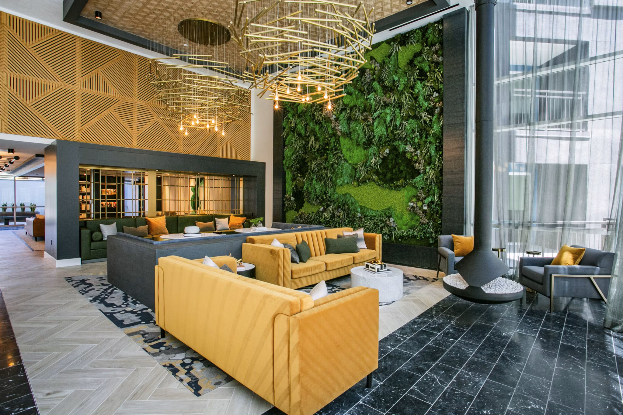 Clubhouse featuring modern lounge seating and entertainment area at Tanager Echo Apartments