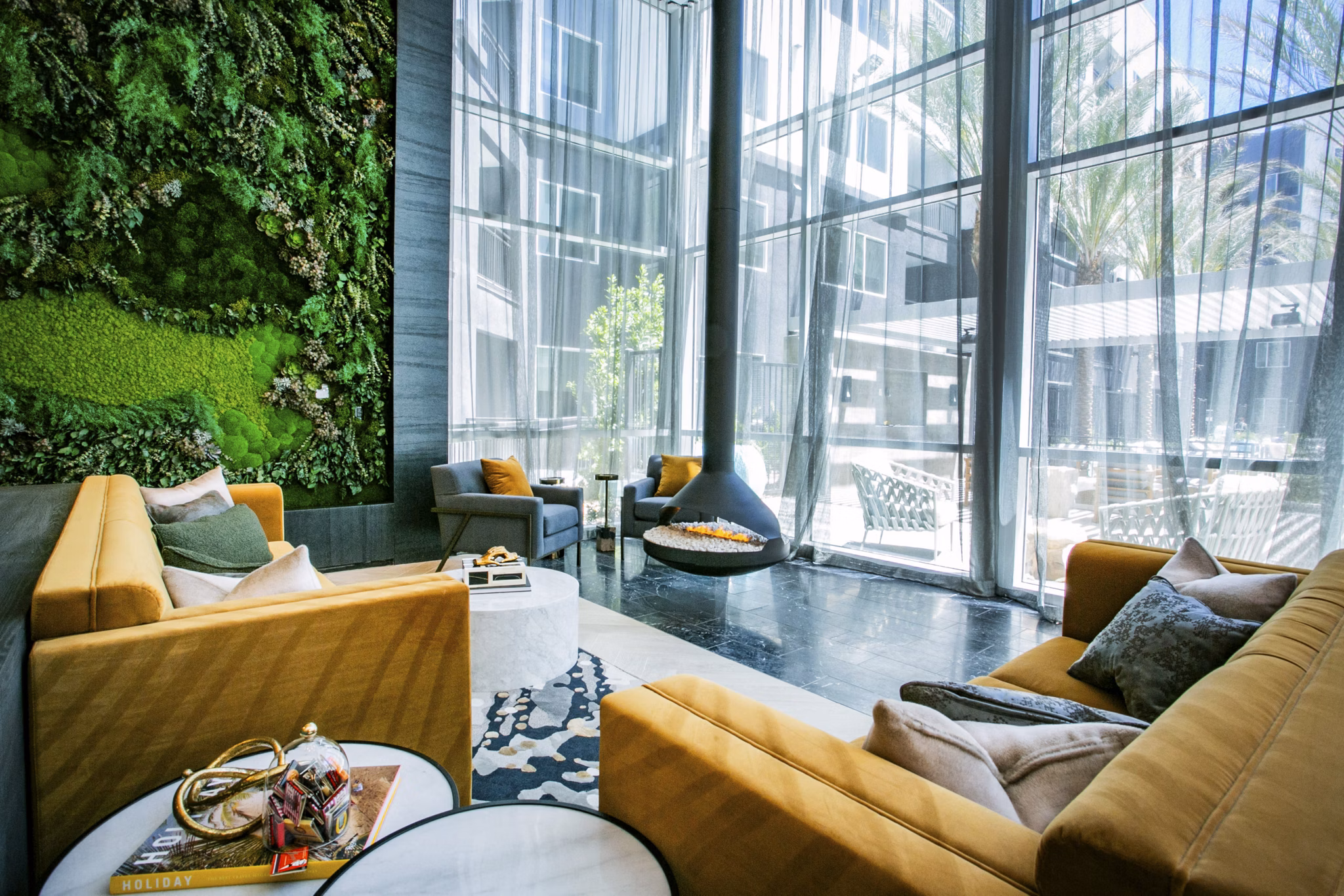 Clubhouse featuring modern design and cozy seating at Tanager Echo Apartments