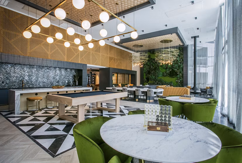 Elegant clubhouse with stylish seating and modern decor at Tanager Echo Apartments, perfect for socializing and relaxation