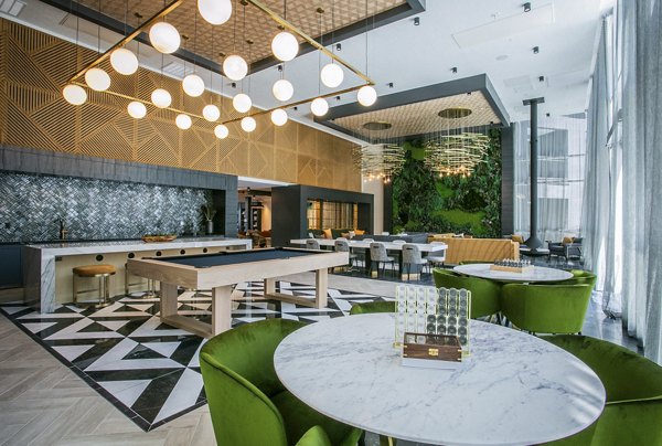 Elegant clubhouse with stylish seating and modern decor at Tanager Echo Apartments, perfect for socializing and relaxation