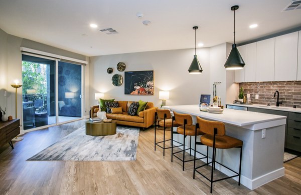 Modern kitchen with stainless steel appliances at Tanager Echo Apartments