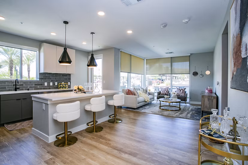 Modern kitchen with stainless steel appliances in Tanager Echo Apartments