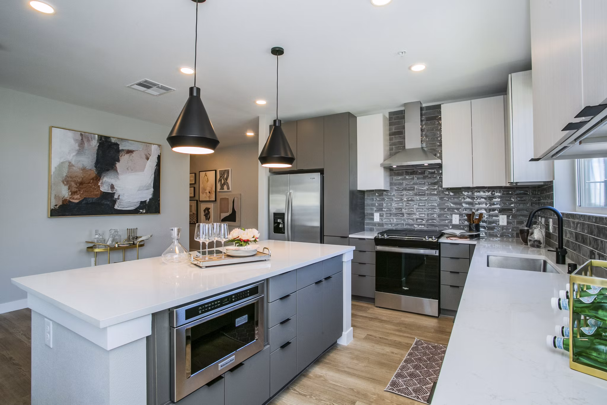 Modern kitchen with stainless steel appliances at Tanager Echo Apartments