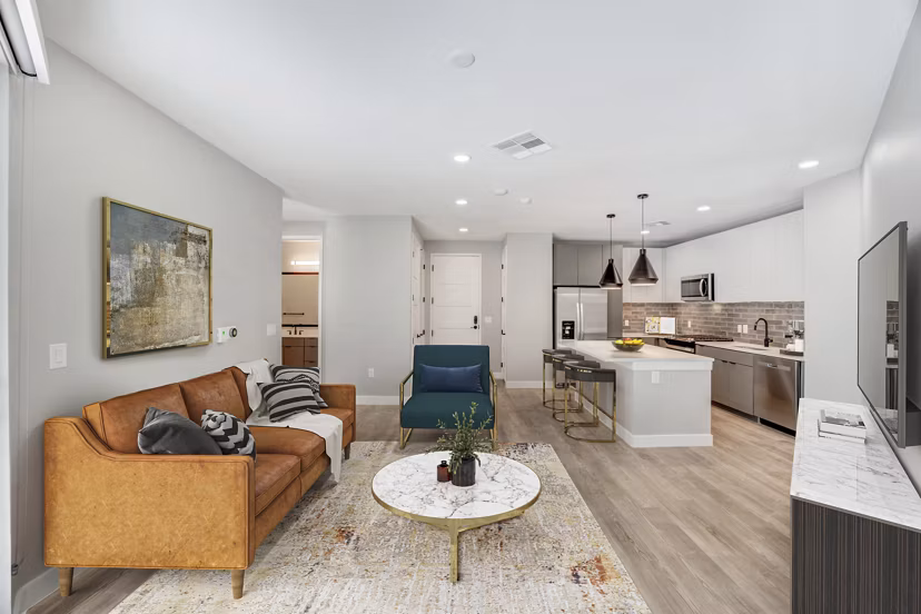 Contemporary living room with stylish decor and ample natural light at Tanager Echo Apartments, perfect Greystar luxury apartment experience