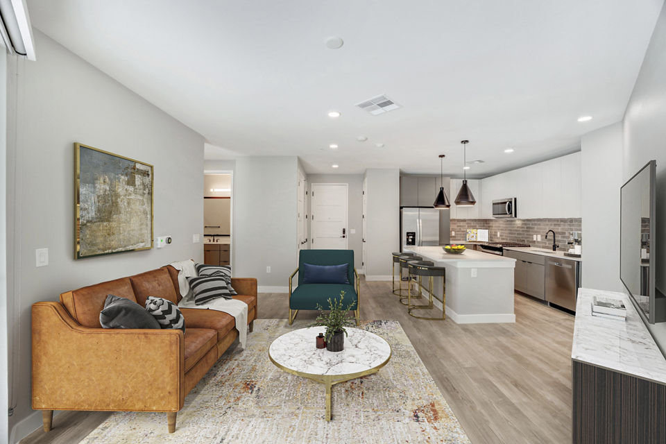 Contemporary living room with stylish decor and ample natural light at Tanager Echo Apartments, perfect Greystar luxury apartment experience