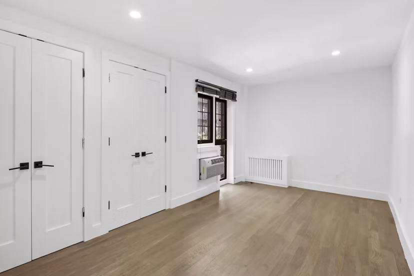 bedroom at 51 Irving Apartments