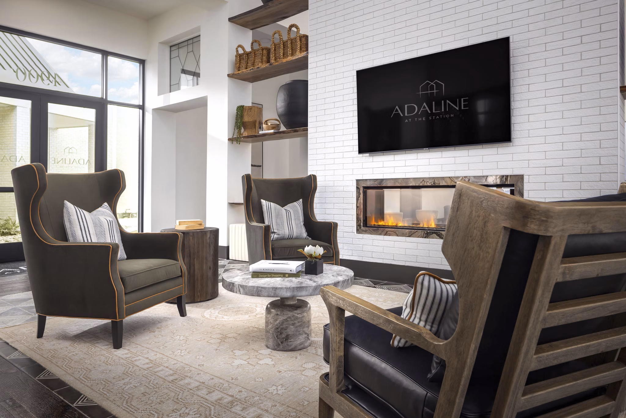 Elegant clubhouse featuring modern seating and decor at Adaline at the Station Apartments