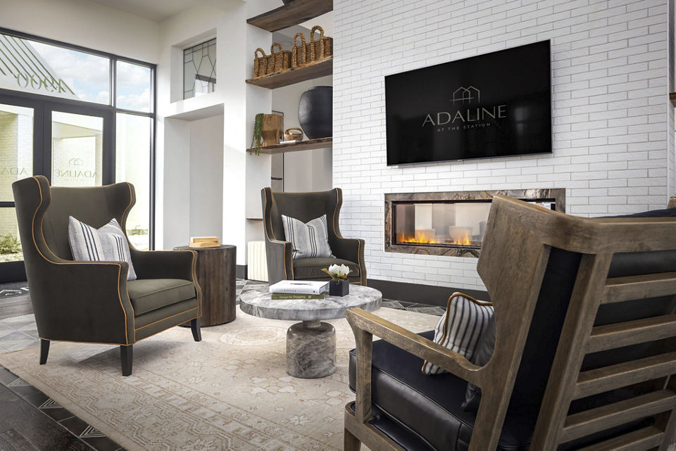 Elegant clubhouse featuring modern seating and decor at Adaline at the Station Apartments